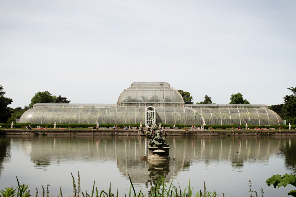 View of The Palm House from across the lake at Kew Gardens